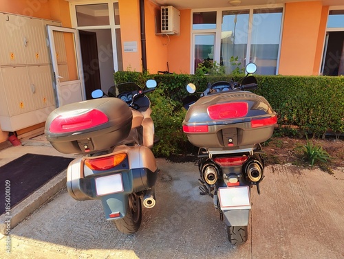 photography of motorbikes parked outside a building high quality horizontal image perfect for campaigns