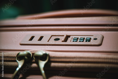 Close up of suitcase lock with security code on travel luggage, safety and protection concept for secure travel and baggage protection