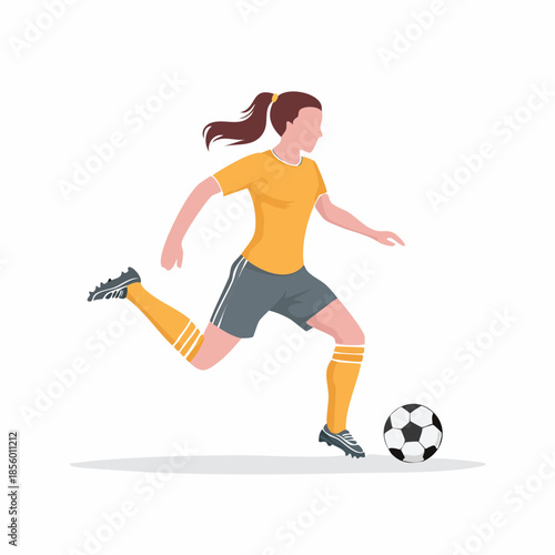 Female soccer player in action striking the ball with powerful athleticism