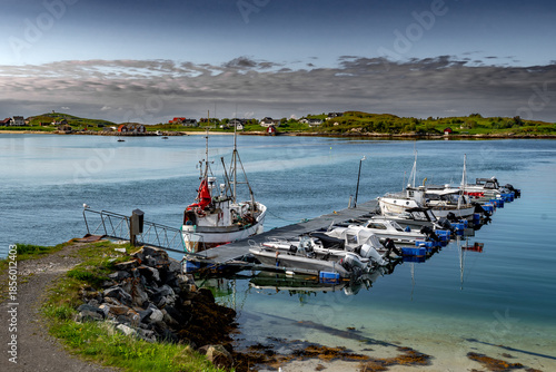 Harbor Of Island Sommaroy With Fisher Boats and Remote Village In Norway