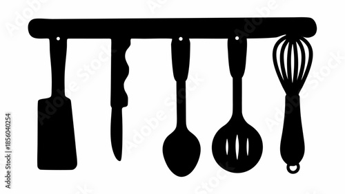 Kitchen utensils hanging on rack in black silhouette