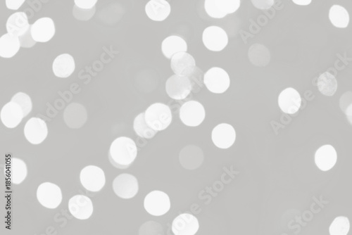 Cloud dancer lights bokeh background, Chrismas lights bokeh. Monochrome abstract background. Blurred and glowing lights. Cloud dancer bokeh lens effect from lighting spots.