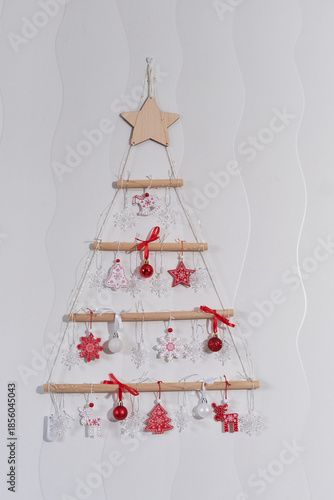 Abstract DIY wall christmas tree decoration with red and white ornaments