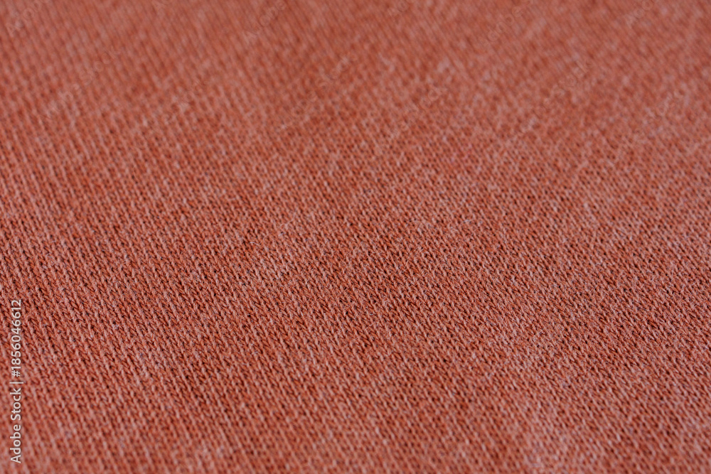 Fototapeta premium Brown terracotta knitted jersey fabric texture, sportswear knit macro background