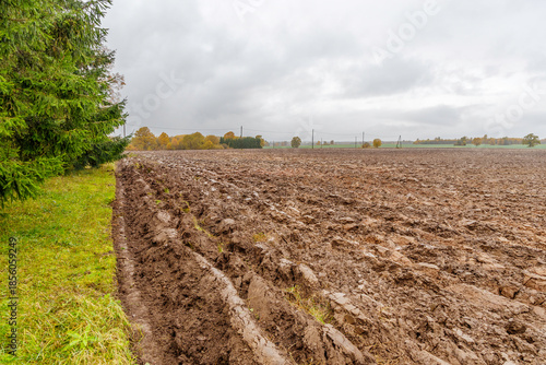 Ploughed Field Under Gloomy Autumn Sky