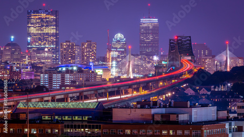 Aerial view of Boston in Massachusetts, USA at night showcasing its skyscrapers and the famous Tobin bridge.