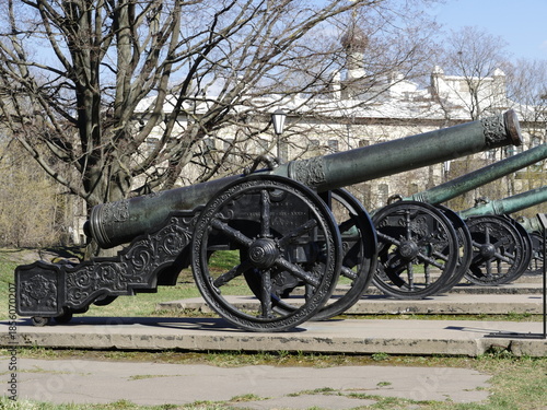 row of bronze medieval cannons, richly decorated