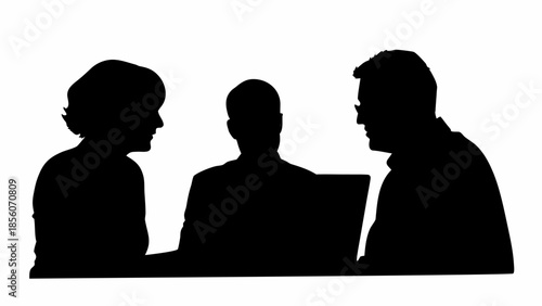 Three people collaborating on laptop in meeting