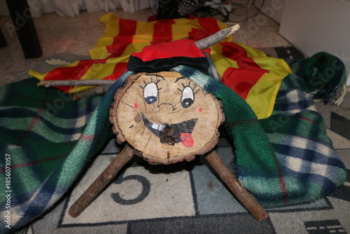 The traditional Christmas Tio gives gifts to children if you poke him with a stick. Typical wooden trunk from Catalonia.