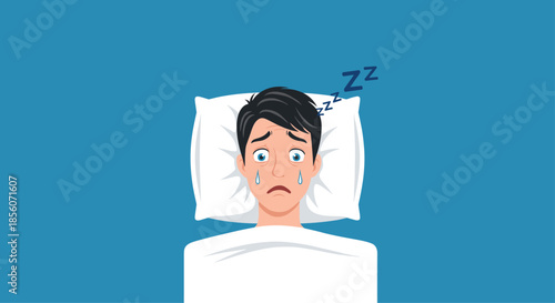 Stressed young man with wide eyes lying in bed unable to sleep, suffering from insomnia and anxiety at night in his bedroom.