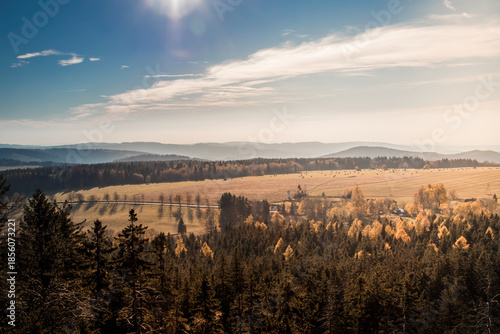 Sunny landscape of the Table Mountains with a view of vast meadows, forests and distant mountain ranges. Calm nature, clear sky and open space invite reflection, mindfulness and deep relaxation.