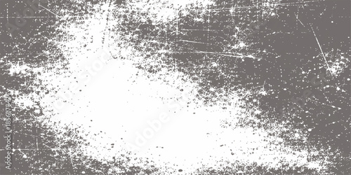 An abstract black and white grunge background featuring a textured pattern of dirty ink splashes, wet paint drops, and dusty old wall surface art