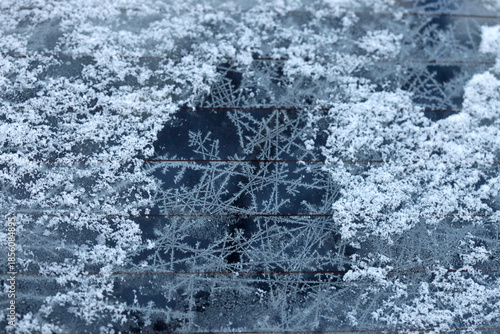White snowflakes on car glass