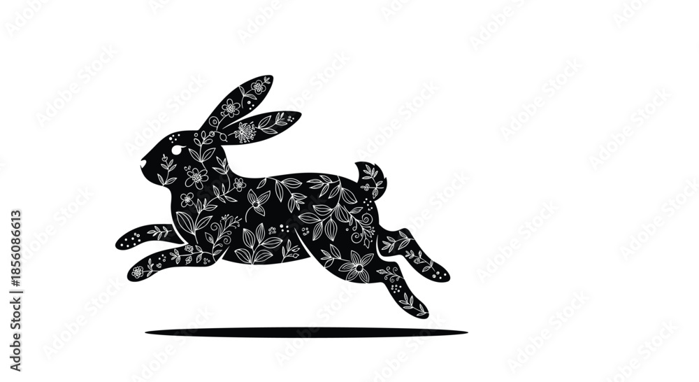 Fototapeta premium Ornate black silhouette of a jumping rabbit or hare, decorated with an intricate white floral pattern inside, isolated on a plain white background.