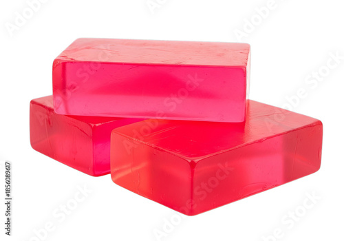 Three vibrant translucent red glycerin soap bars stacked neatly
