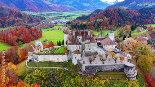 Gruyeres Castle and autumn forest aerial panorama view. Gruyeres, Canton of Fribourg, Switzerland.