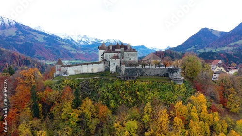 Gruyeres Castle and autumn forest aerial panorama view. Gruyeres, Canton of Fribourg, Switzerland.
