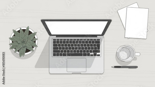 Overhead view of an open modern silver laptop positioned centrally on a light wooden desk next to essential workspace items for productivity