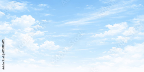 Beautiful blue sky with fluffy white clouds on a bright, clear day