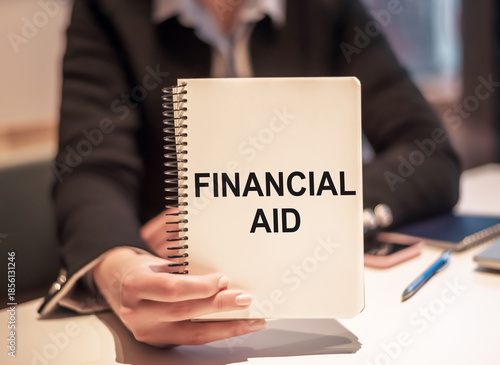 Holding Financial Aid Handbook During a Consultation in an Office Setting