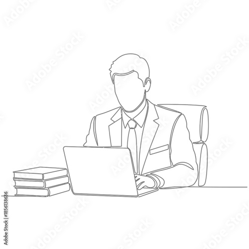 Businessman Working On Laptop In Office With Books