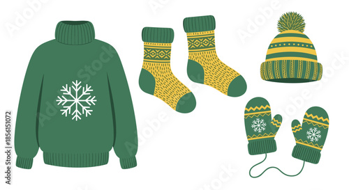 Collection of warm green and yellow winter clothing including a snowflake sweater, patterned socks, a beanie hat, and cozy mittens.