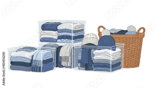 Organized clear storage bins filled with neatly folded blue and white winter clothing, including sweaters, scarves, and hats, with a wicker basket.