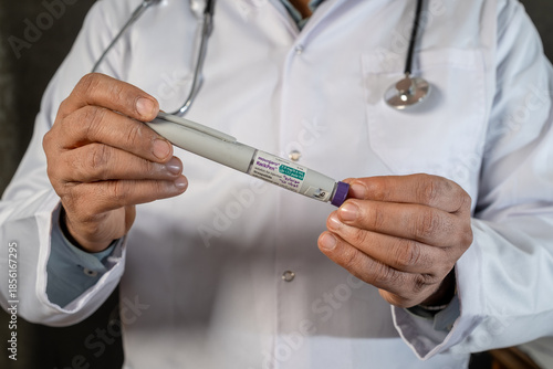 Medical doctor presenting Mounjaro tirzepatide KwikPen medication used for diabetes management and chronic weight loss