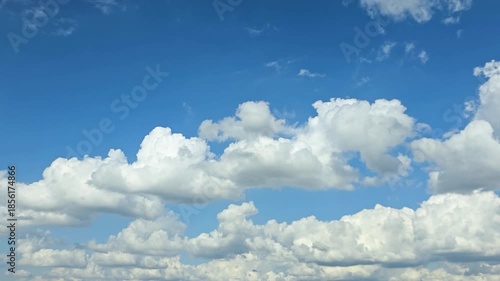 Timelapse, blue Sky clouds background atmosphere with floating cloud layer and open copy space, clean bright tranquil mood