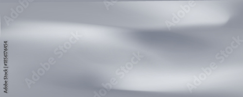 Silver foil background with a metallic mirror texture. Chrome gradient surface with soft, abstract light.