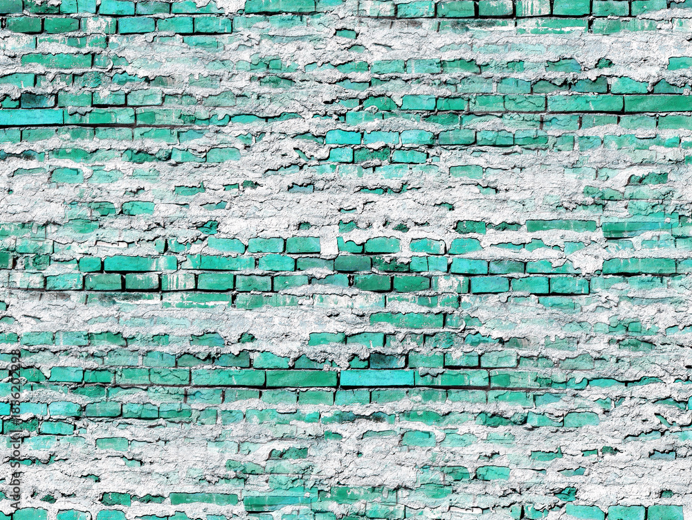 Fototapeta premium Textured brick wall with a teal-green color, covered with patchy white mortar. The wall's surface has a distressed appearance.