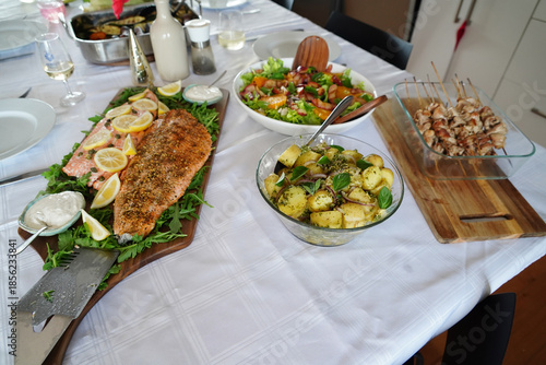 Delicious fresh salmon prepared on a platter with lemon and salad
