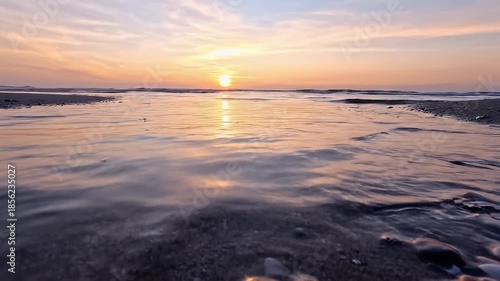 Serene Beach Sunset with Calm Waters.