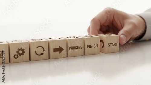 Wooden cubes representing workflow enhancement aligned manually using shallow depth and clean soft blurred atmosphere