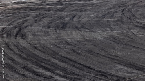 Konstfotografi abstract asphalt street road background with black tire marks on race track, Texture and background car automobile and automotive skid tire marks