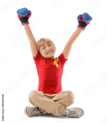 Cute boy in boxing gloves w...
