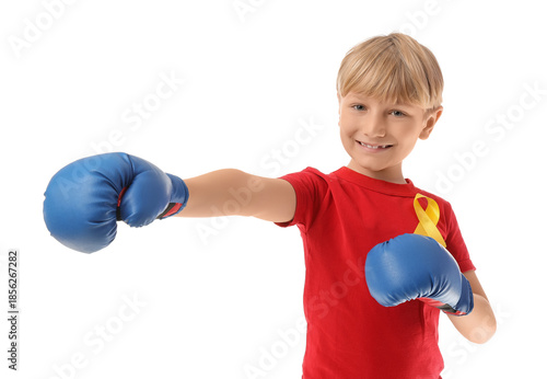 Cute boy in boxing gloves with yellow ribbon on white background. Childhood c...