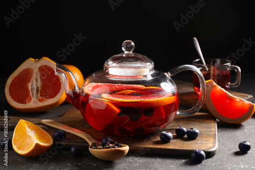 Glass teapot with hot fruit...