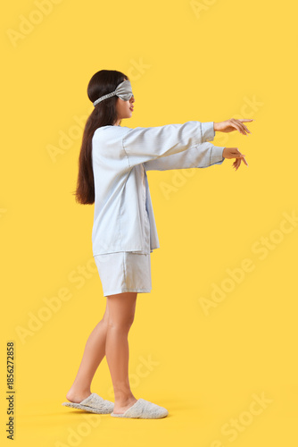 Female sleepwalker in pajam...