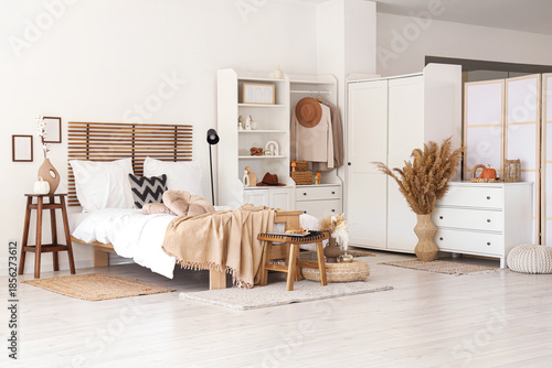 Interior of light bedroom w...