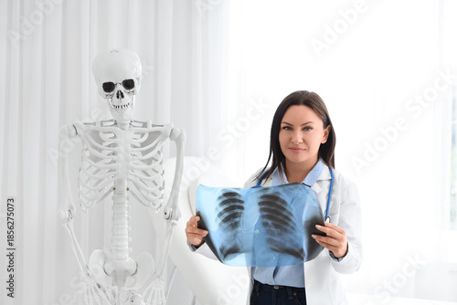 Female doctor with x-ray im...