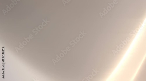 Light reflection on a plain surface captures abstract background animation, ideal design elements, or artistic projects needing minimalistic textures.