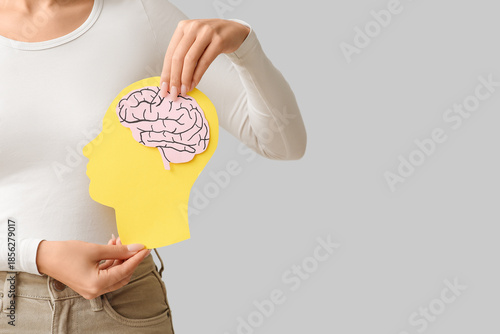 Young woman with paper brai...