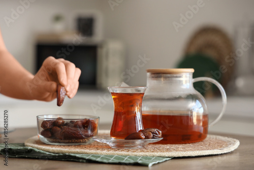 Young woman with glass of t...