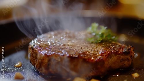 Close-up of sizzling and delicious grilled steak with herbs and spices, cooked to perfection and garnished with fresh greens