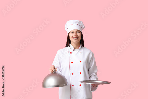 Female chef with silver tra...
