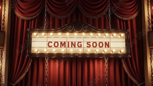 Vintage movie theater marquee sign with coming soon text and bright bulbs