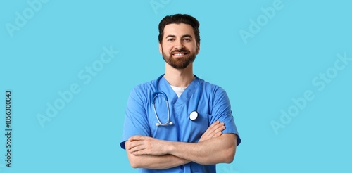 Happy male doctor with stet...