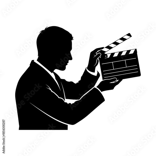 Silhouette of man holding movie clapboard in hand.