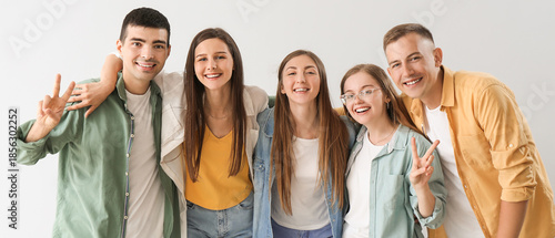 Group of happy friends show...